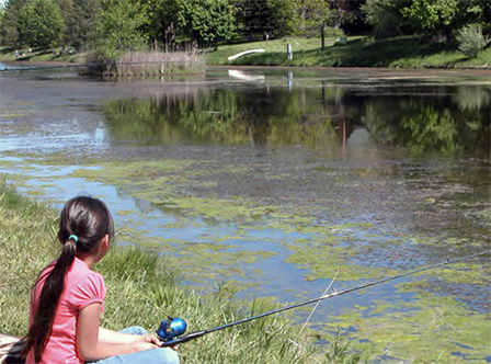 An Oneida child fishing in a small, stocked pond on the Oneida Reservation. Photo credit: Oneida Environmental Staff