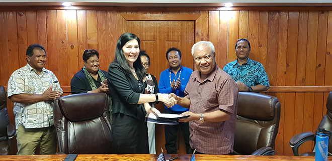 U.S. Ambassador Amy Hyatt and Republic of Palau’s Minister of Finance Elbuchel Sadang shaking hands