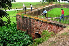 Surveying damage done to the bastion walls of Fort Jackson Credit: NPS/FEMA" alt="Surveying damage done to the bastion walls of Fort Jackson Credit: NPS/FEMA