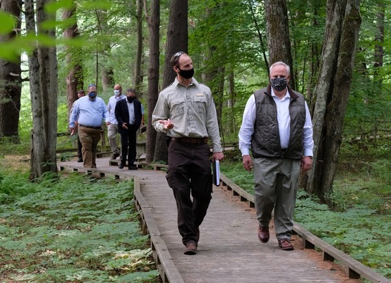 Secretary Bernhardt receives a briefing on the status of the Lower Peverly Dam removal project.