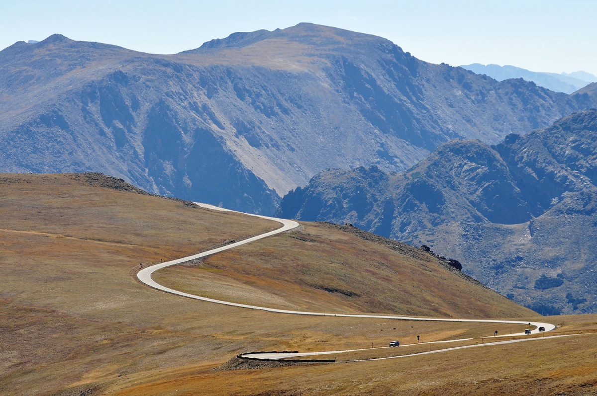 A road winds through the mountainside 