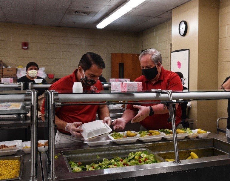 Secretary Bernhardt and Eastern Band of Cherokee Indians Principal Chief Richard Sneed package lunches at the Cherokee Central Schools.