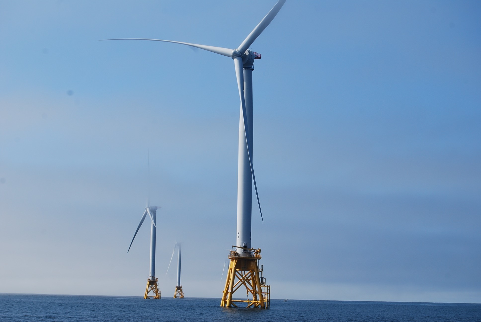 Wind turbines in ocean water.