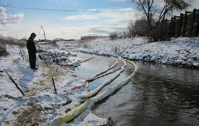 sorbent booms stretched across Sand Creek in December 2011, near Commerce City, Colorado